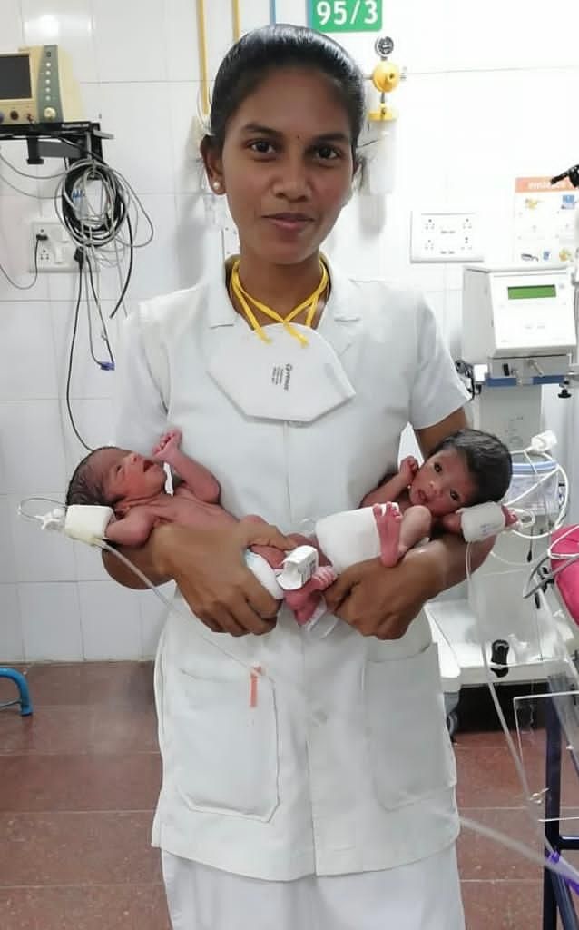 Nithya with twin babies.jpeg